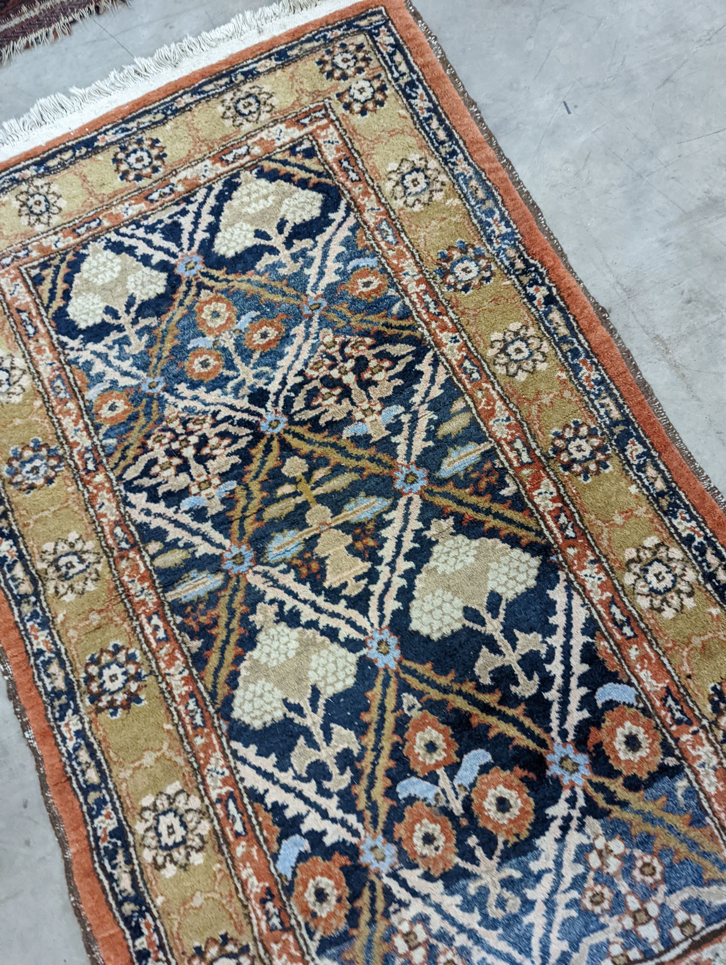 An Afghan brick red ground geometric runner and a smaller Afghan rug, larger 306 x 106cm